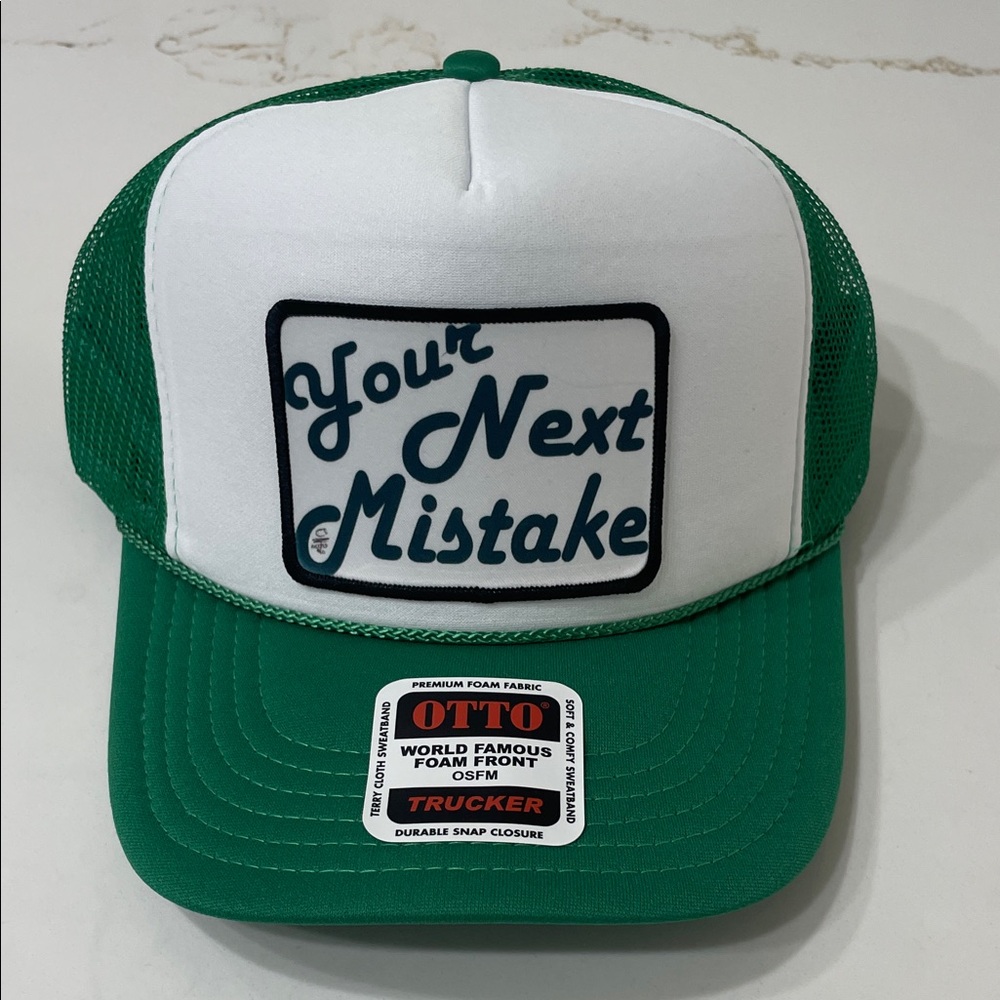 YOUR NEXT MISTAKE Green and White Trucker HAT